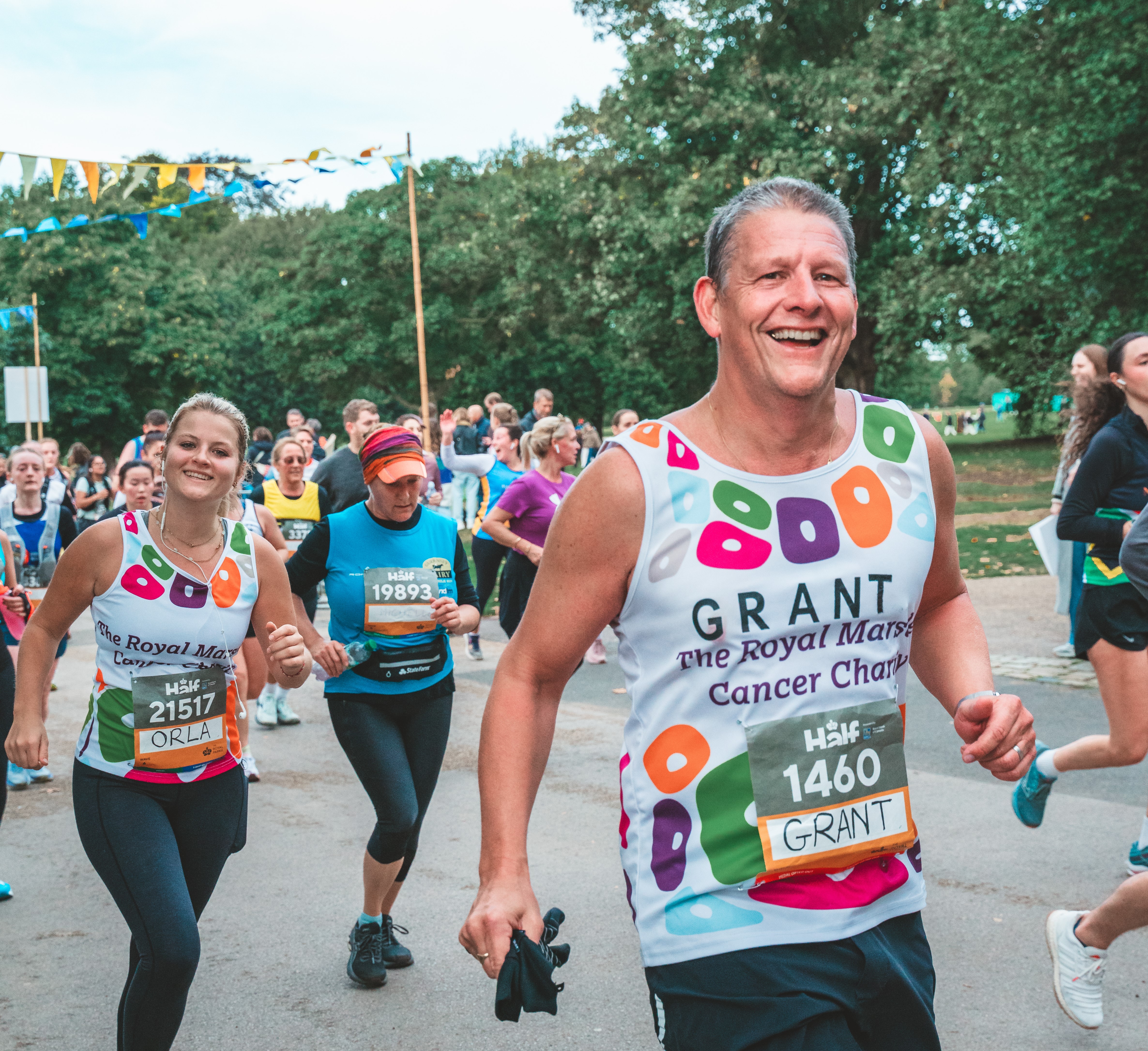 An image of two Team Marsden runners smiling at the camera