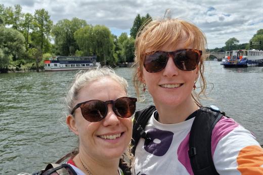 Two people smiling on Thames Path route