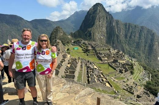 Two hikers standing in front of Machu Picchu