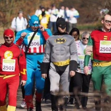 Marsden March participants dressed as superheroes - The Flash, Batman, Robin and Captain America