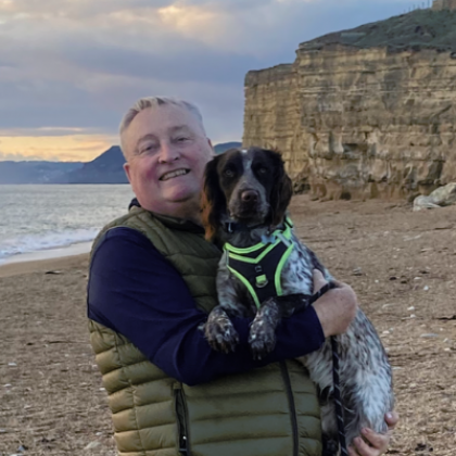 Malcolm Pearce at the beach with his dog 