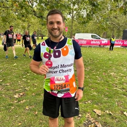 Team Marsden Runner in St James' Park holding his medal after the Vitality 10K 2023