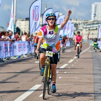 London to Brighton cycle ride participant cheering The Royal Marsden Cancer Charity. 