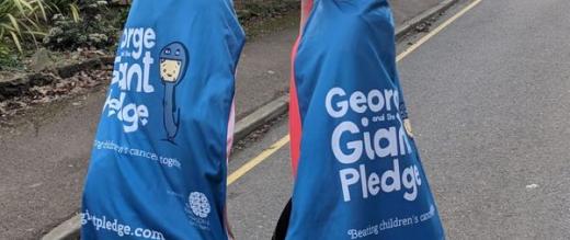 Vicky and Woody in George and the giant pledge capes
