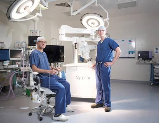 Kieran Power, Head of Plastic Surgery, and Aadil Khan, Consultant Plastic Surgeon with the new Symani Surgical System for microsurgery procedures at The Royal Marsden